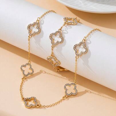 一套优雅时尚闪亮金色镂空四叶草吊坠项链和手链首饰套装（女士款）