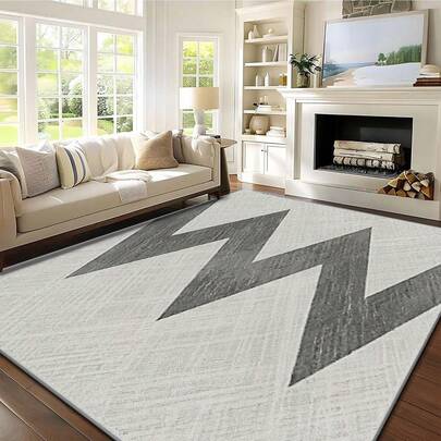 1 件装现代简约风格地毯，浅灰色底，深灰色锯齿几何图案。天鹅绒材质，重约 850 克，厚约 0.6 厘米。地毯耐磨、防滑、易于清洁。多种尺寸可选。适用于厨房/客厅/餐厅/卧室/阳台/浴室/书房。家居装饰的理想之选。