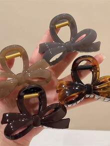 新款高端时尚发夹，后脑勺处饰有蝴蝶结扣。鲨鱼造型发饰发夹。夏季沙滩装扮必备，度假风发夹。 - 彩色 - 查看 1