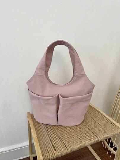 1个粉色尼龙帆布金属按扣双口袋时尚设计百搭休闲纯色简约春夏新款小众手提包，适合女性日常使用