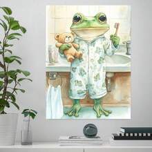 Plano 2D, 1 pieza de pintura en lienzo plana 2D de una rana adorable con pijama, estampada con un patrón de una rana pequeña, sosteniendo un cepillo de dientes y un oso de peluche, de pie en un baño. Pintura en lienzo, plano 2D - Enmarcado - Ver 2