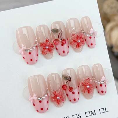 10片手绘3D樱花蝴蝶结波点美甲贴片，椭圆形柔和粉色调，适合日常、春夏、休闲、节日等场合，是送给女性和女孩的礼物，附赠收纳盒