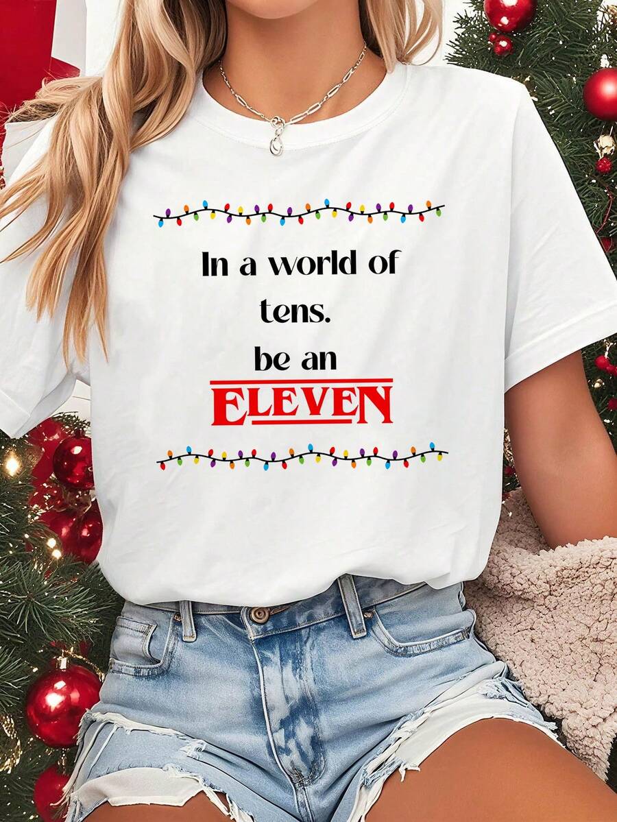 Women's Eleven-Inspired T-Shirt, Short Sleeves, Crew Neck - White, Lightweight, For Spring/Summer, Casual, For Holiday Parties - Fan Outfit - Fantasy Christmas Design And Iconic Quote - Machine Washable, Comfortable Casual Wear. Graphic Tee With Illustrations Inspired By Eleven, Featuring Gorgon, Mike, Lucas, Eleven, Dustin, Demo Dogs, Hawkins, And India.Na Jones Fans. Exquisite T-Shirts, Holiday T-Shirt. - White - View 1