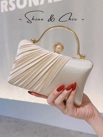 Túi cầm tay cô dâu bằng satin màu sâm panh, tay cầm kim loại đính ngọc trai, túi dự tiệc cưới.