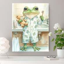 Plano 2D, 1 pieza de pintura en lienzo plana 2D de una rana adorable con pijama, estampada con un patrón de una rana pequeña, sosteniendo un cepillo de dientes y un oso de peluche, de pie en un baño. Pintura en lienzo, plano 2D - Enmarcado - Ver 3
