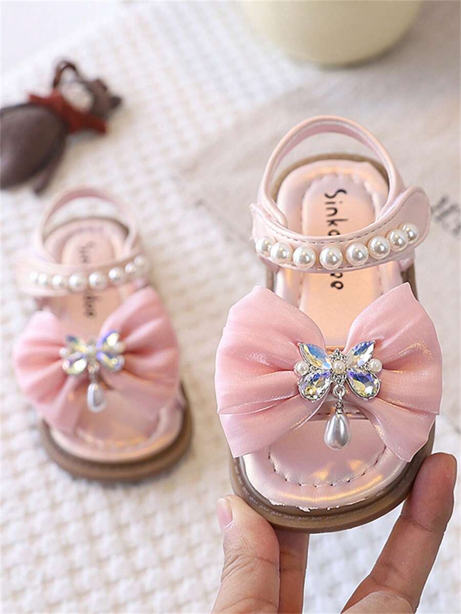 一双可爱时尚的按摩垫平底儿童凉鞋，柔软防滑，适合幼儿学步，春、夏、秋、冬四季穿着。 - 粉色 - 查看 1