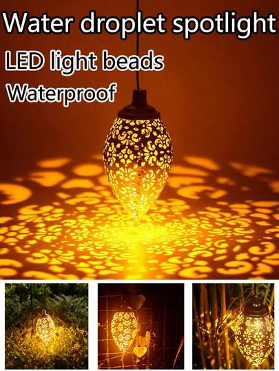 Đèn pha năng lượng mặt trời hình giọt nước (2/1 cái). Chống thấm nước. Chất liệu sắt với họa tiết trang trí. Có thể treo bằng móc. Thích hợp sử dụng trong sân vườn, trang trí cây xanh biệt thự và các dịp trang trí lễ hội khác.