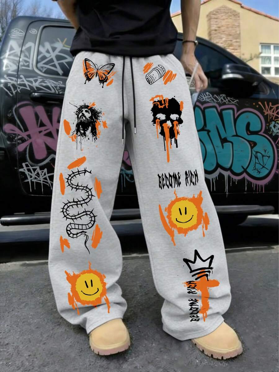 Pantalones de chándal de estilo callejero de moda para hombres en gris claro, con diseño gráfico y de letras creativo en amarillo y naranja tipo graffiti, y tela versátil, suave y cómoda - Gris Claro - Ver 1