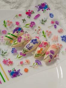 精致花卉美甲贴纸，包含色彩缤纷的雏菊、薰衣草、铃兰、郁金香、叶子和对比鲜明的线条元素。适合春日郊游、下午茶、度假拍照和日常通勤等场合。是美甲新手、花卉爱好者、时尚女性和学生DIY美甲的理想之选。 - 彩色 - 查看 7