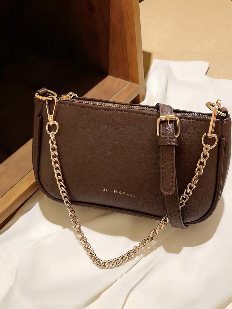 This Women's Shoulder Bag Is Made Of Solid-Color PU Material, With A Coffee-Colored Crocodile Pattern And Letter Decoration, Giving It A Fashionable And Elegant Appearance. The Bag Features A Metal Zipper And A Metal Chain At The Top, Allowing It To Be Carried By Hand Or On The Shoulder. The Interior Space Can Accommodate Daily Essentials Such As Lipstick, Keys, And Cosmetics. Suitable For Women's Commuting, Outings, Shopping, And Various Occasions.