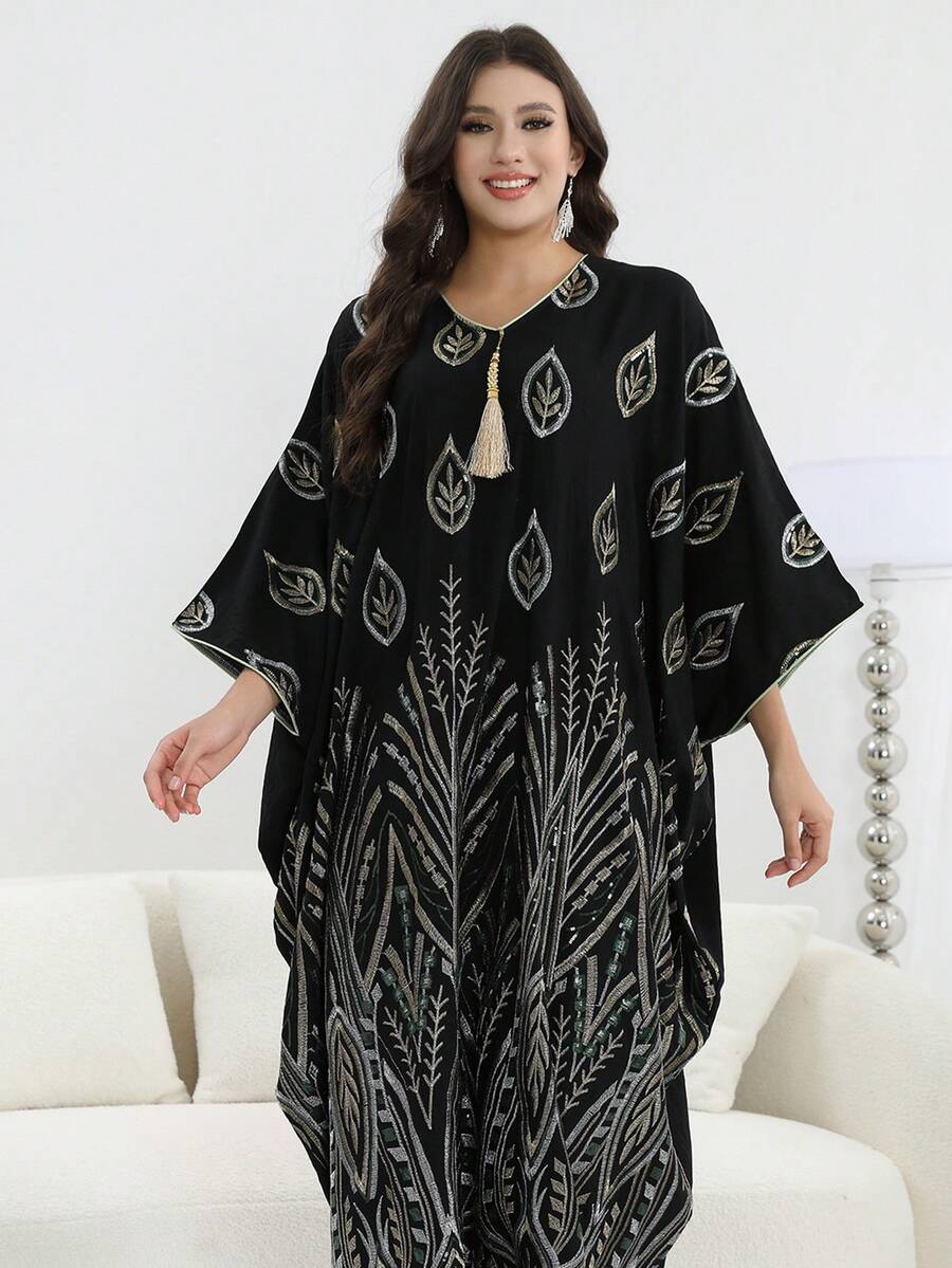 Mẫu thiết kế mới năm 2026: Áo dài Ả Rập Jalabia thêu hạt cườm bạc thanh lịch với tua rua, cổ chữ V và tay áo loe, kiểu Abaya thời trang và sang trọng, váy dài truyền thống dành cho nữ mùa xuân/hè 2026 cho lễ Eid Al-Adha.