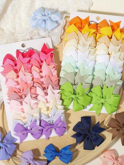 Bộ 20 chiếc kẹp tóc nơ ruy băng grosgrain nhiều màu, chất liệu vải satin không gây hại cho tóc, kiểu dáng ngọt ngào, phù hợp cho sử dụng hàng ngày và đi học.