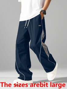 Pantalones jogger de estilo urbano para hombres - Con rayas laterales, bolsillos y cintura con cordón, pantalones deportivos casuales de color contrastante - Azul Marino - Ver 2