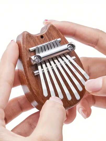 Đàn Kalimba mini 8 nốt, hình bàn chân mèo dễ thương, đàn piano ngón tay bằng gỗ, nhạc cụ nhỏ gọn, dễ mang theo cho người mới bắt đầu, kèm dây đeo, nhạc cụ giảm căng thẳng, âm thanh trong trẻo, nhỏ gọn và dễ chơi, món quà lý tưởng cho bạn bè và người yêu, có thể dùng làm mặt dây chuyền hoặc vật trang trí.