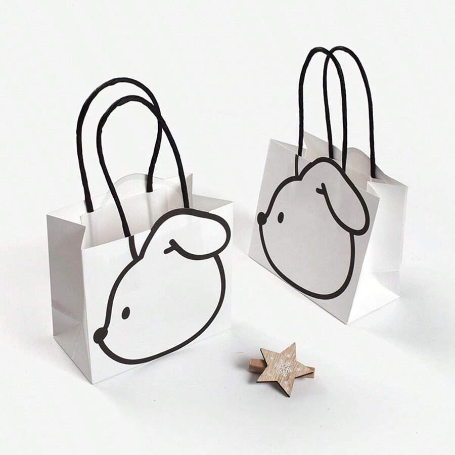 This Minimalist Rabbit-Shaped Paper Bag Features A Pure White Background With Simple Black Line Sketches To Create An Adorable And Versatile Design. Made Of Thick, Durable Kraft Paper, It Is Paired With Matching Paper Rope Handles For Both Style And Functionality. Suitable For Packaging Children's Day Gifts, Daily Gifting, Or Storage And Organization, The Small Size Is Delicate And Cute, Making It A Great Choice For Niche, -Worthy Gifts. - Multicolor - View 1
