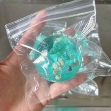 1个手工制作的月光白挤压减压球,采用海洋塑料制成,是生日、圣诞节、万圣节、复活节的完美礼物。 - 彩色 - 查看 6