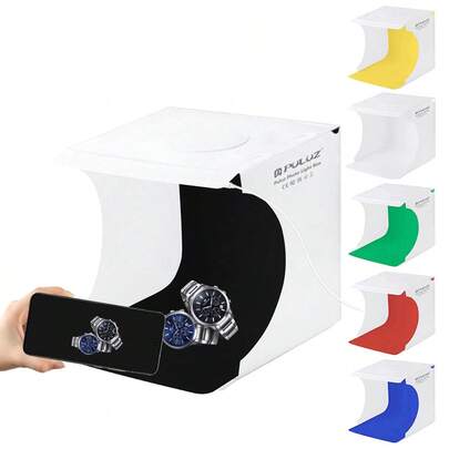  PULUZ 20厘米可折叠便携式550流明摄影灯箱套装，包含6块彩色背景布（黑、白、黄、红、绿、蓝），展开尺寸：24厘米 x 23厘米 x 23厘米