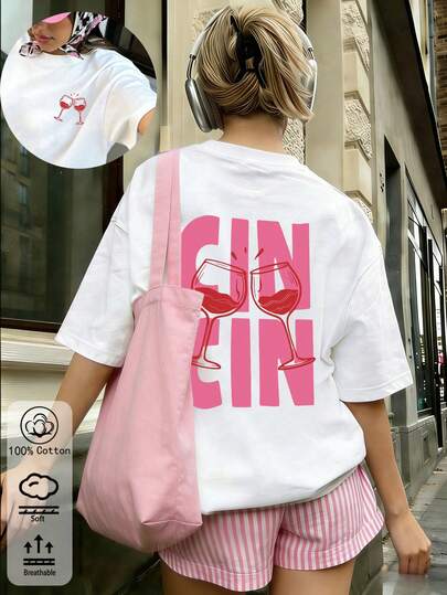 Nieuwe collectie lente/zomer voor dames: oversized wit katoenen T-shirt met een print van een roze wijnglas, perfect voor een comfortabele casual look in het dagelijks leven, een mix van vintage en minimalistische stijl.