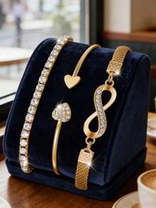 [Juego de 4 piezas] Reloj de cuarzo con tono dorado para mujer con pulsera de acero, emparejado con un conjunto de pulseras con diseños de corazón, cristal y símbolo del infinito. Clásico y elegante, este es un regalo refinado para el día a día para una mejor amiga, novia o madre. No incluye caja de regalo. - Dorado - Ver 2