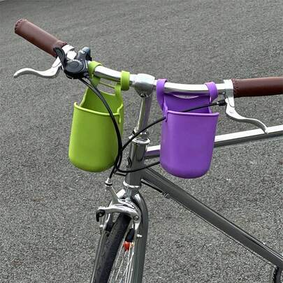 Giá đỡ cốc xe đạp bằng silicon bền và có thể gập lại, kèm túi đựng điện thoại. Dễ dàng lắp đặt, có thể đựng đồ uống và điện thoại di động, đồng thời có ngăn chứa phụ kiện. Linh hoạt và chắc chắn, phù hợp cho xe đạp và xe tay ga.