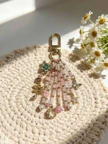 Mặt dây chuyền hình ngôi sao tua rua màu hồng phấn tinh tế, thiết kế hình bướm, sao và trăng đính hạt, phụ kiện trang trí túi điện thoại nữ tính, thanh lịch. - Nhiều màu - Xem 1