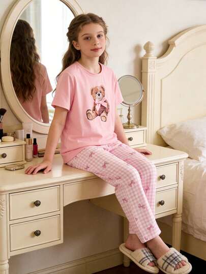Cute And Sweet Pink Bear Pajama Set, Very Suitable For Girls. The Top Is A Lovely And Sweet Light Pink Short Sleeve T-Shirt With A Teddy Bear Graphic And 3D Bow Design On The Chest. The Pants Have A Pink And White Plaid Pattern Covered With A Pink Bow Print. With An Elastic Waistband, The Soft Fabric Is Comfortable For Wearing At Home, Casual Sleepwear, Parties, Etc. Also Makes A Great Gift For Daughters.