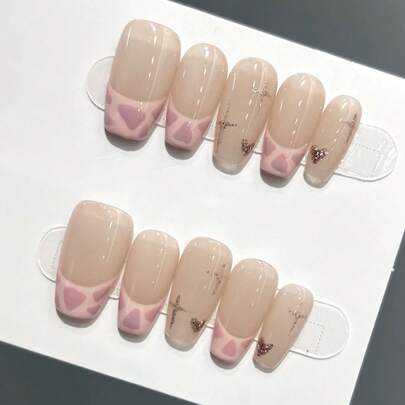 10片纯手工制作的按压式美甲片，长款棺材形美甲，粉色系，甜美酷女孩风格，透明裸粉色底色，粉色豹纹法式甲尖，水钻十字架和爱心装饰，可爱百搭的按压式美甲片，适合女性和女孩，春夏秋冬节日派对及日常佩戴。