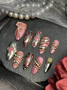 Bộ 10 móng tay acrylic hình hạnh nhân, bộ dụng cụ làm móng nghệ thuật ngày Valentine, móng mắt mèo màu hồng & đỏ, bạc, đỏ, hoàn hảo cho mùa thu và mùa đông. Chúng có họa tiết hoa 3D, các đường sọc vàng lỏng bất đối xứng với hạt thép mạ vàng và đá quý. Hoàn hảo cho các bữa tiệc, đám cưới và sử dụng hàng ngày, những dụng cụ làm móng acrylic này là món quà tuyệt vời dành cho phụ nữ và các cô gái. - Nhiều màu - Xem 3