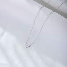 1 chiếc dây chuyền hình trái tim tối giản bằng bạc S925, đính đá quý nhiều mặt sáng bóng, toát lên vẻ lãng mạn và hoàn hảo cho trang phục hàng ngày và mùa hè dành cho phái nữ nhân dịp Lễ Tình nhân. - Dây chuyền hình trái tim ba viên kim cương - Xem 7