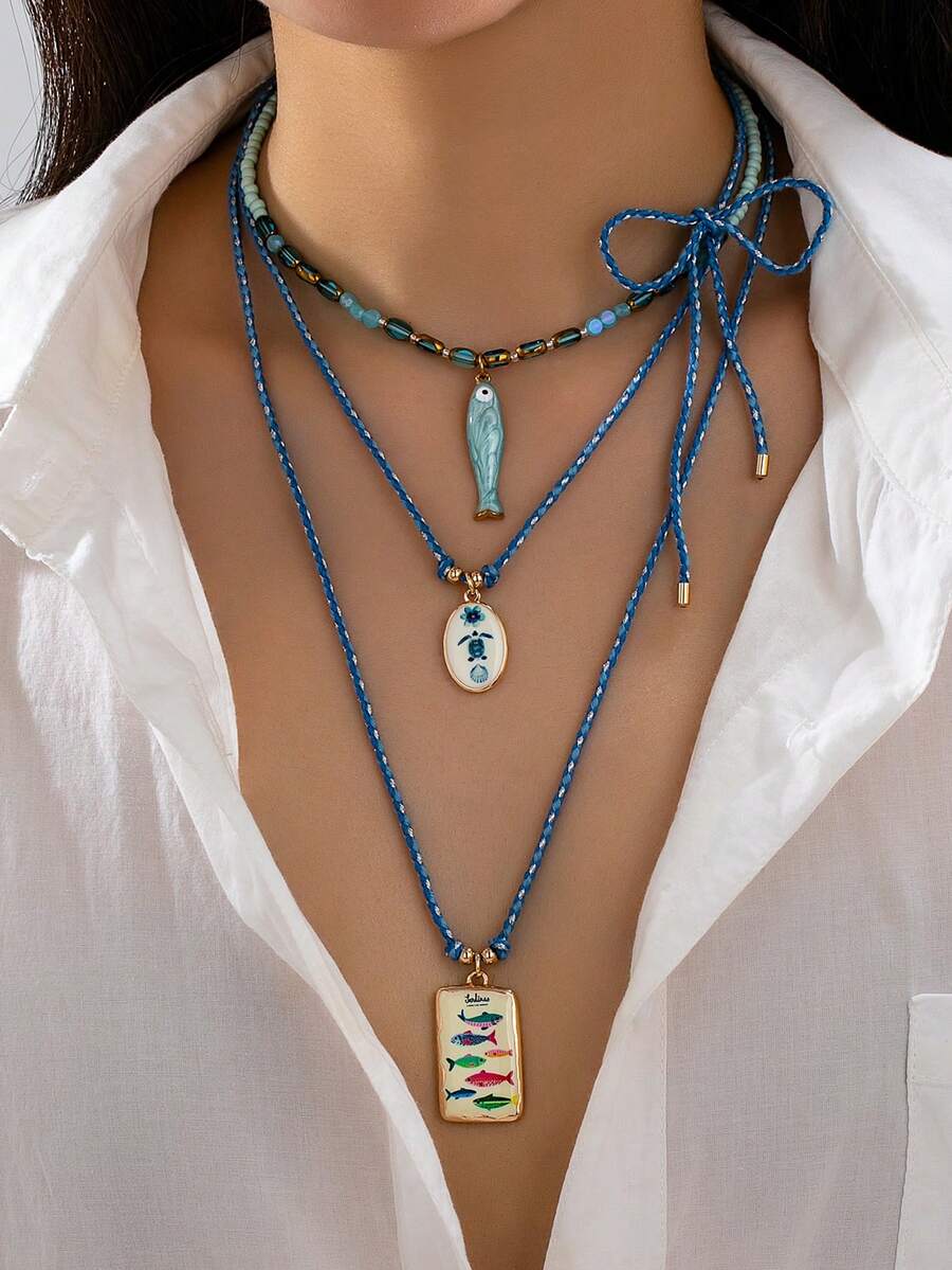 Juego de 3 Collares Boho en Capas para Mujeres, Collares de Cadena de Cuerda Tejida a Mano con Colgante de Esmalte, Joyería Bohemiana de Estilo Tropical para Uso Diario - Conjunto de collar con colgante geométrico de pez pequeño - Ver 1