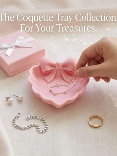 A Heart-Shaped Jewelry Tray With A Pink Bow, Made Using 3D Printing Technology, Suitable For Placement On A Dressing Table, Sink, Or For Storing Jewelry. It Is A Choice Home Decoration, Office Desks, And Jewelry Trays