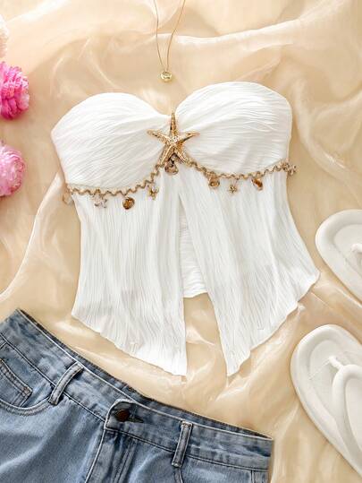 Áo hai dây xếp ly họa tiết sao biển và vỏ sò, chất liệu satin với viền tua rua, thích hợp cho kỳ nghỉ biển, vừa ngọt ngào vừa gợi cảm.