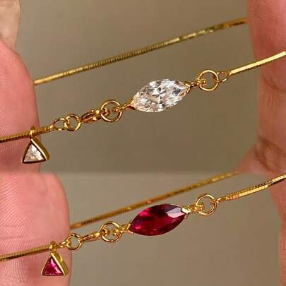 Vòng tay xương rắn tối giản bán chạy nhất với giọt nước pha lê Zirconia đỏ dành cho nữ, đa năng.