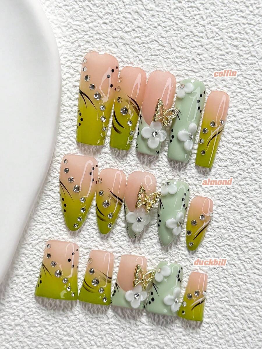 10件森林风手工美甲套装，包含假指甲、镂空蝴蝶、钻石美甲装饰、手工花瓣、线条点缀美甲装饰、绿色指甲油，清新风格，附赠美甲工具（1个果冻贴+1个指甲锉），三种尺寸可选：杏仁形、鸭嘴形、棺材形，适合聚会、日常佩戴、派对、拍照、春夏通勤等场合。 - 彩色 - 查看 1