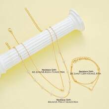 三件套仿珍珠首饰套装，包括项链和手链，非常适合女性约会、度假和日常佩戴。简约时尚，也是情人节礼物的理想之选。 - 金色 - 查看 5