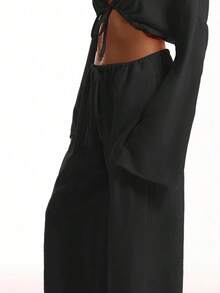 Pantalones de playa con efecto de lino con nudo delantero, pantalones con cordón, ropa de playa elegante, bohemia y casual para vacaciones, primavera y aeropuerto - Negro - Ver 5