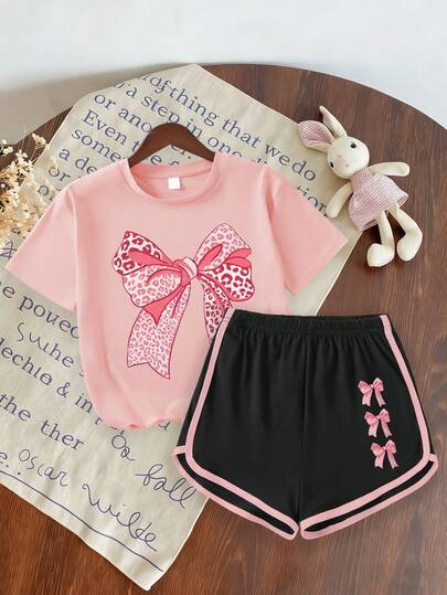2pcs/Set Girls' Casual Outfit, Pink Bow Round Neck Short Sleeve Top Paired With Matching Bow Print Black Shorts, New Summer Collection