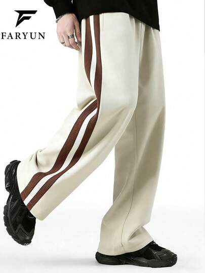 Quần thể thao nam ống đứng rộng rãi, có sọc bên hông, kiểu dáng thường ngày, đa năng, phù hợp cho đường phố, trường học và mặc hàng ngày vào mùa xuân và mùa thu.