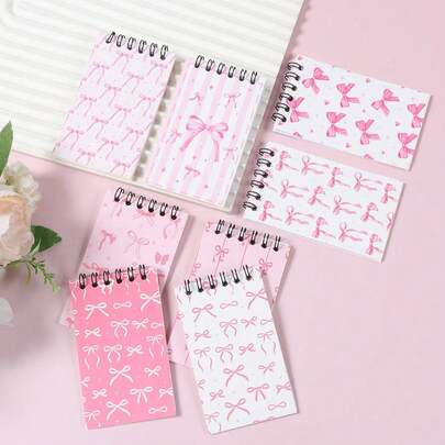 8本迷你粉色蝴蝶结螺旋笔记本，螺旋装订，小型撕取式便签本，迷你口袋尺寸2.36 x 3.94英寸，可爱便携日记本，文具，学生奖励，适合家庭、办公室、学校用品，非常适合生日派对礼物、生日礼物、奖励。