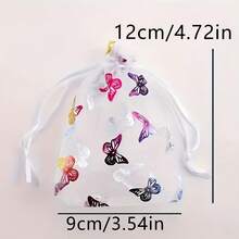 Conjunto de 10 elegantes saquinhos de organza com cordão e estampa de borboletas em tons suaves. Tecido de malha transparente com fechamento duplo, ideais para guardar joias, doces e embalar presentes. Perfeitos para casamentos, festas de aniversário e pequenas lojas (multicoloridos). - Multicolorido - Ver 6