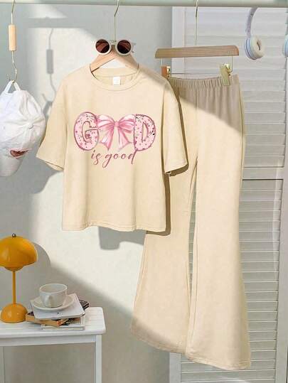 This Casual Set Features A Unique Pink Bow Print Design, Specially Crafted For Young Ladies. The Set Includes A Pink Short Sleeve Round Neck T-Shirt And A Flare Leg Pant.