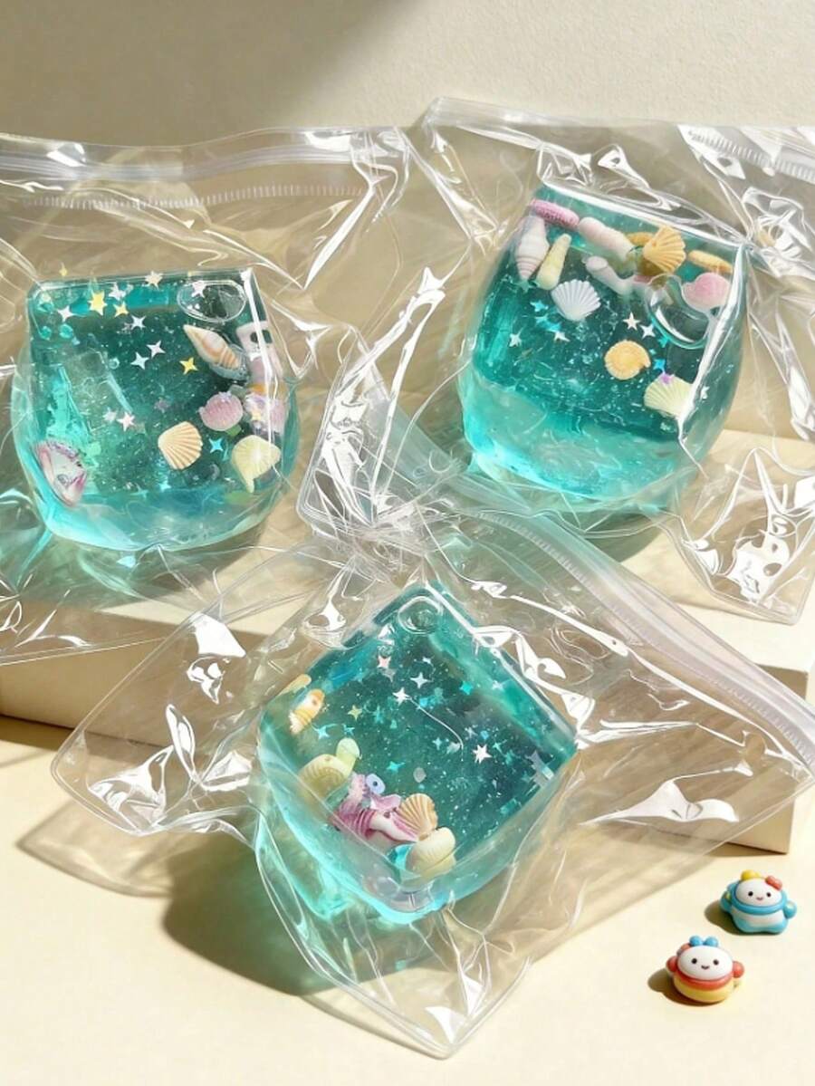Ocean Transparent Cube Squishies, This Soft Squeeze Toy You Need! This Wonderfully Squishy Toy With Teal Gel, Seashell & Star Glitter Inside, Relieves Adult Stress, Ideal Desktop Decor & Small Gift For Office, Home And Adult Parties - Multicolor - View 1