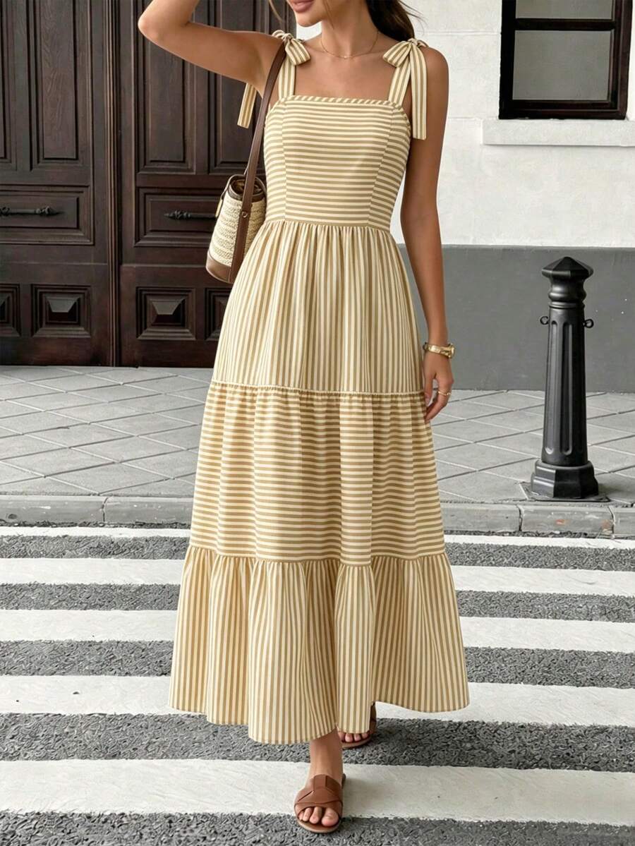 Đầm nữ phong cách Bohemian kẻ sọc, hở lưng, dài ngang gối, có dây buộc vai, túi, dáng chữ A xòe bồng bềnh, phù hợp cho mặc hàng ngày và đi nghỉ mát. - Màu vàng - Xem 1
