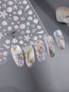 5D立体海洋生物美甲贴纸，自粘闪光塑料材质，适合夏季美甲，包含海星、贝壳、海洋生物、气泡、珊瑚、海螺等图案。一次性闪亮梦幻动物印花，是节日礼物的理想之选。 - 彩色 - 查看 10