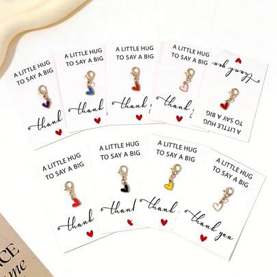 Bộ 9 món | Móc khóa hình trái tim nhiều màu sắc | Mặt dây chuyền hình trái tim nhỏ | Phụ kiện quà lưu niệm xuyên biên giới. Mặt dây chuyền hình trái tim này có nhiều màu sắc và phù hợp với nhiều trường hợp: Có thể dùng làm móc khóa hoặc trang trí túi xách, và cũng có thể dùng làm món quà nhỏ ý nghĩa kèm theo thiệp chúc mừng, hoàn hảo cho quà tặng ngày lễ.