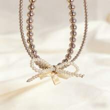 1条奢华双层珍珠蝴蝶结手机挂绳，法式优雅防丢手机链，多功能包包钥匙扣挂饰 - 白色 - 查看 3