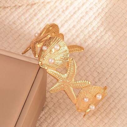 1 chiếc vòng tay hình sao biển tối giản bằng thép không gỉ, thích hợp cho nữ giới đeo khi đi nghỉ mát, hẹn hò hoặc dự tiệc.