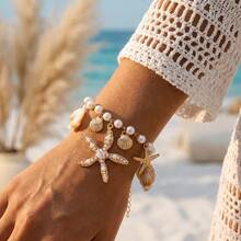 Bộ trang phục phong cách Santorini lấy cảm hứng từ đại dương, gồm vòng tay hình sao biển và vỏ sò, đồ đi nghỉ mát. - Vàng - Xem 1
