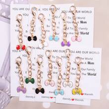 6件/7件浪漫蝴蝶结钥匙扣套装，“永恒与温暖”口袋拥抱卡，口袋拥抱纪念币。适用于家庭聚会、生日派对、结婚纪念日、派对装饰、母亲节礼物等场合，时尚优雅的钥匙扣礼品套装。创意母亲节礼物之选，送给您挚爱的母亲的完美礼物。 - 彩色 - 查看 12