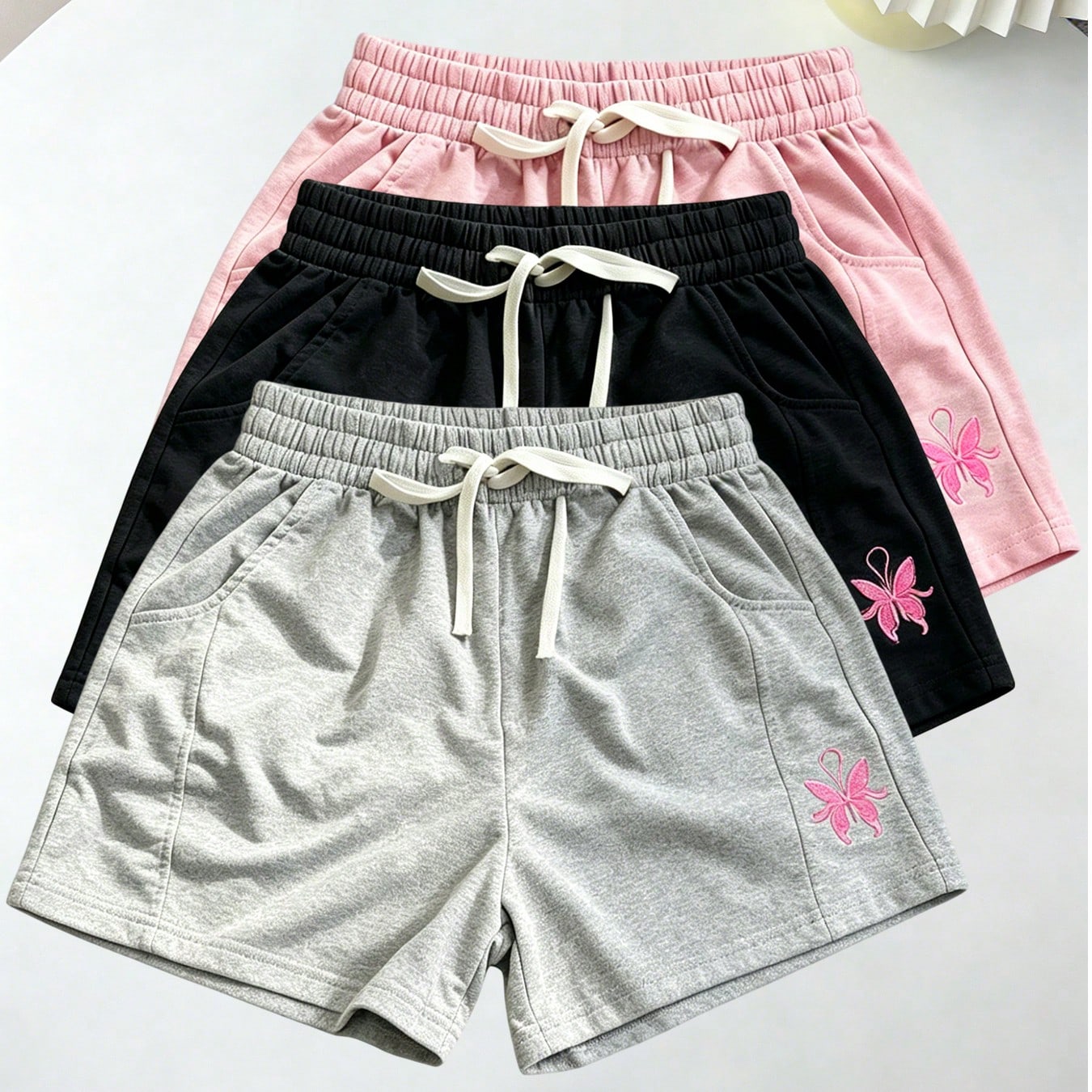 Nuevas llegadas de verano, estilo dulce y refrescante para mujer, pantalones cortos casuales con bordado de mariposa rosa, versátiles para usar en ca